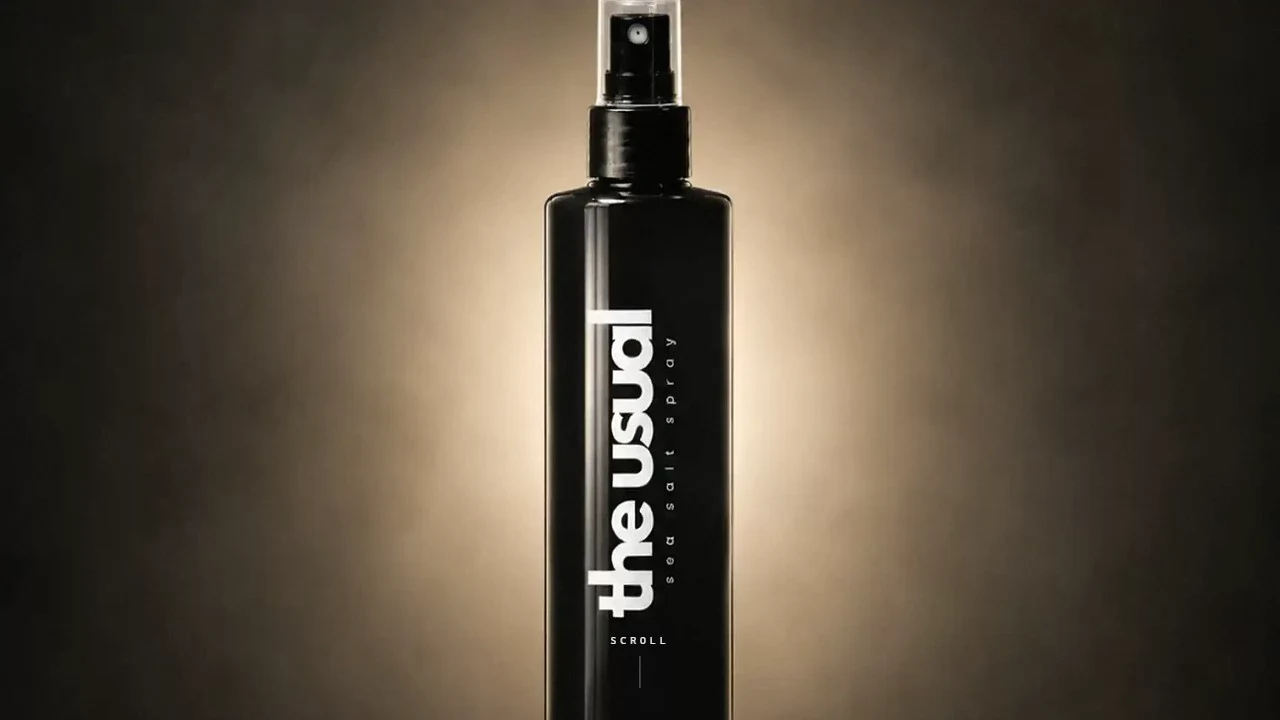 The Usual haircare product against a warm dark background